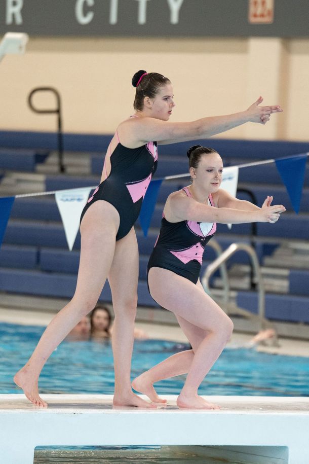 Ravensong Waterdancers finishing their routines on side of the pool