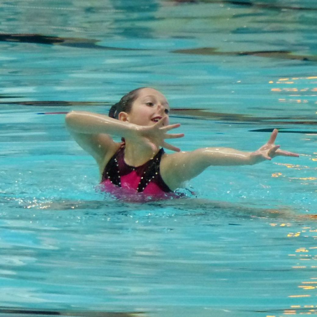 Waterdancer in the pool doing routine, aquago program