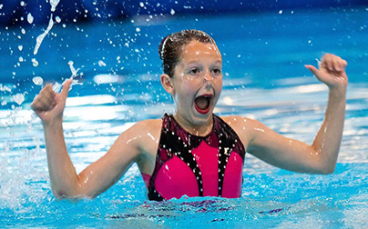 Waterdancer having fun in the pool with her artistic swimming routine
