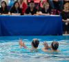 Two waterdancers performing in pool, Solo Duets Program