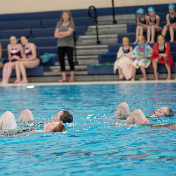 Duo of waterdancer girls underwater doing routine, duets program
